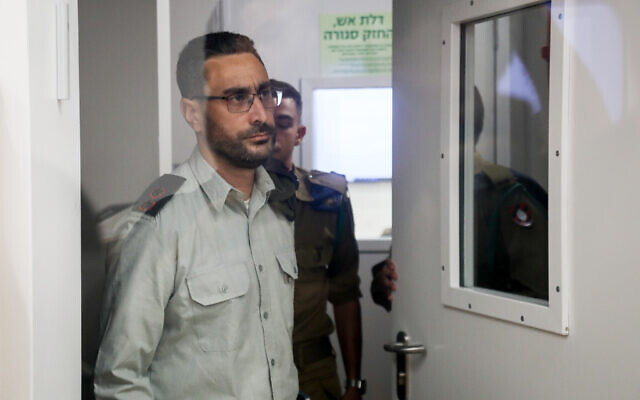 Dan Sharoni, an IDF officer accused of sexual offenses, arrives for a court hearing at a military court in Beit Lid, July 24, 2022. (Flash90)