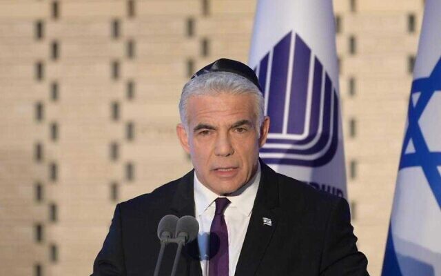 Prime Minister Yair Lapid at a state ceremony on Mount Herzl commemorating fallen soldiers in Operation Protective Edge, July 10, 2022. (Amos Ben Gershom/GPO)