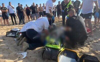 Medics try and resuscitate a man who  drowned off the coast of Rosh Hanikra in northern Israel on July 11, 2022 (MDA)