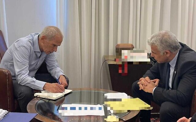 Prime Minister Yair Lapid (right) meets with Public Security Minister Omer Barlev at the Prime Minister's Office in Jerusalem, July 17, 2022. (Courtesy)