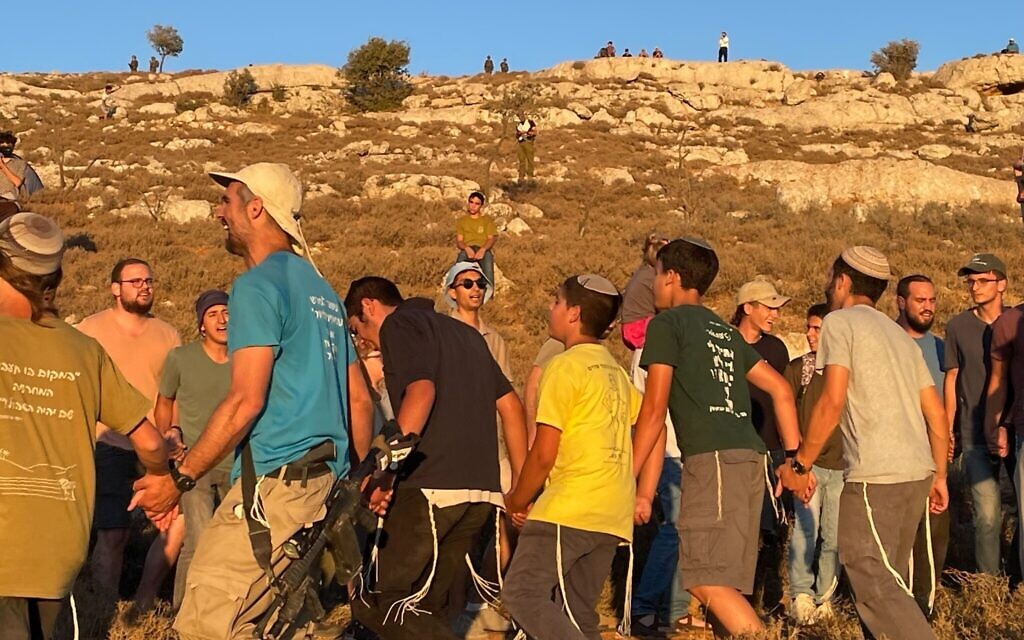 Settler activists at the 'Nofei Yehuda' outpost near Kiryat Arba on July 20, 2022. (Jeremy Sharon)