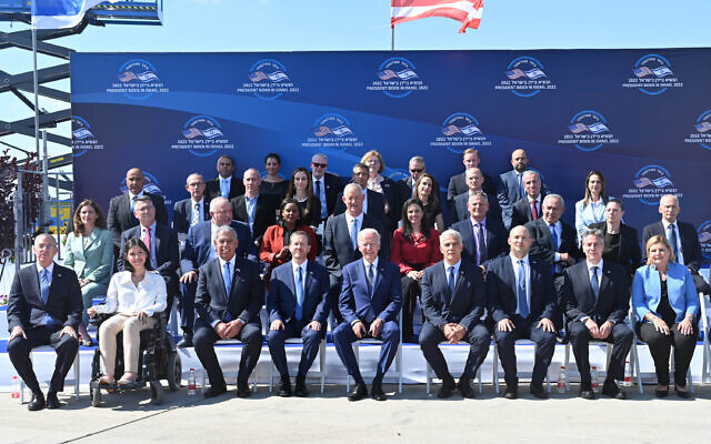US President Joe Biden poses for an official group photo with Prime Minister Yair Lapid, President Isaac Herzog, other Israeli officials and visiting Americans at Ben Gurion Airport, July 13, 2022. (Kobi Gideon / GPO)