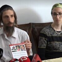 Screen capture from video of Shmuel, left, and Giti, right, parents of missing teenager Moshe Klinerman, 16, at their home in Modiin Illit, July 3, 2022. (Ynet)