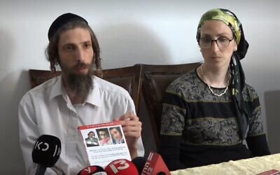 Screen capture from video of Shmuel, left, and Giti, right, parents of missing teenager Moshe Klinerman, 16, at their home in Modiin Illit, July 3, 2022. (Ynet)