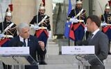 Prime Minister Yair Lapid (L) and French President Emmanuel Macron hold a press conference at the Elysee Palace in Paris, France, July 5, 2022. (Amos Ben-Gershom/GPO)