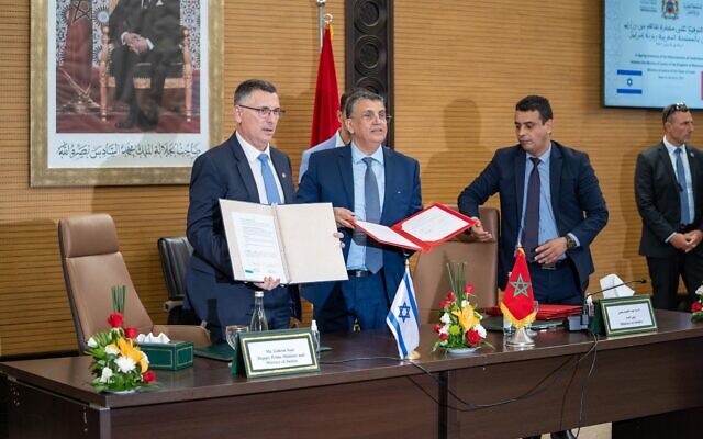 Justice Minister Gideon Sa'ar and his Moroccan counterpart Abdellatif Ouahbi sign a bilateral agreement on legal cooperation in Rabat on July 26, 2022. (Courtesy)