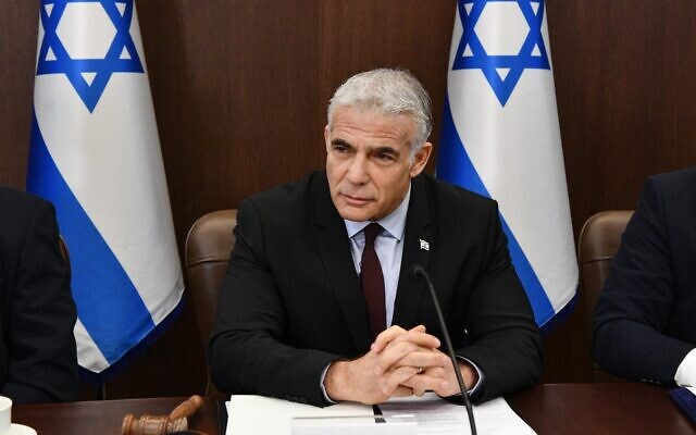 Prime Minister Yair Lapid leads his first weekly cabinet meeting, July 3, 2022. (Haim Zach/GPO)