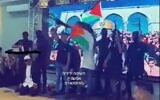 Screenshot from a video uploaded to social media showing students at the Anata High School for boys in East Jerusalem in a play that includes students dressed up as gunmen "shooting" students dressed up as religious Jews, July 20, 2022. (Twitter)