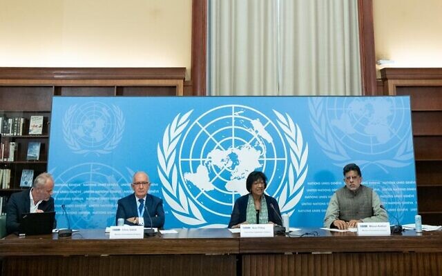 Navanethem Pillay (center right), chair of the United Nations Independent International Commission of Inquiry on the Occupied Palestinian Territory, including East Jerusalem, and Israel, briefs reporters on the first report of the Commission. On the right is Miloon Kothari, and in the center left is Chris Sidoti. (UN Photo/Jean Marc Ferré)
