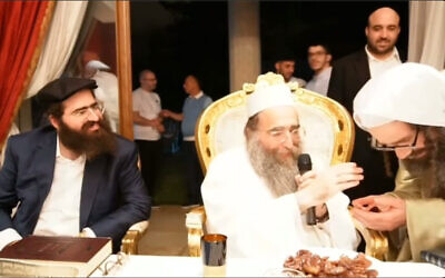 Rabbi Yoshiyahu Pinto, center, blesses Lev Tahor member Uriel Goldman, right, in Morocco, in a still from an undated video made available to The Times of Israel. (screen capture: Lev Tahor Survivors)