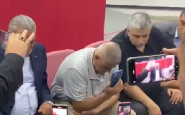 The fathers of two Palestinian gunmen killed while confronting Israeli troops in the West Bank speak with Palestinian Authority President Mahmoud Abbas on the phone, July 24, 2022. (Screenshot/ Twitter)