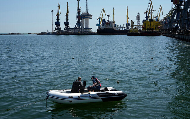 Servicemen of pro-Russia Donetsk People's Republic Emergency Ministry work to defuse a Ukrainian mine in an area of the Mariupol Sea Port, on April 29, 2022. (AP Photo, File)