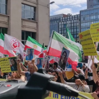 Anti-regime Iranian dissidents protest outside the Belgian Parliament against a prisoner exchange deal with Tehran that will potentially see the release of convicted Iranian agent and terrorist Assadollah Assadi on July 5, 2022. (Screenshot/Twitter)