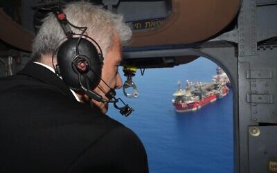 Prime Minister Yair Lapid flies over the Karish gas field on July 19, 2022. (Amos Ben Gershom/GPO)