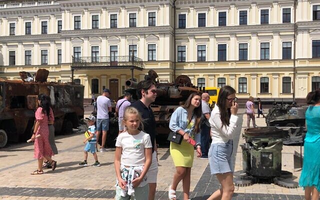 Ukrainians examine destroyed Russian military vehicles in Old Kyiv, July 21, 2022 (Lazar Berman/The Times of Israel)
