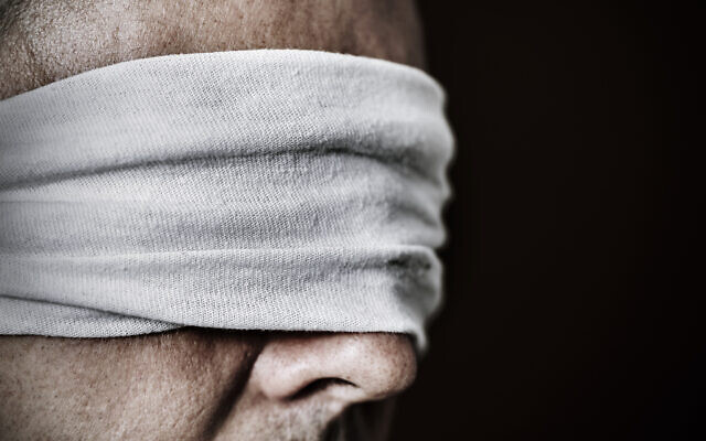 Illsutrative: An imprisoned man whose eyes are blindfolded (nito100; iStock by Getty Images)