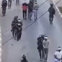 Screengrab said to show Israeli troops escorting detained Palestinians in Silwad, West Bank on July 6, 2022 (Screen grab/Twitter)