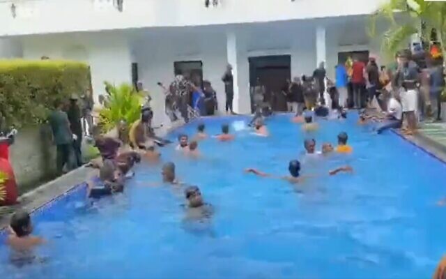 Protestors jump into pool at president's residence in Colombo, Sri Lanka, July 9, 2022. (Screen grab/Daily Mirror Sri Lanka)