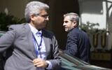 Iran's chief nuclear negotiator Ali Bagheri Kani (R) is leaving the Coburg Palais, the venue of the Joint Comprehensive Plan of Action (JCPOA) in Vienna on August 4, 2022. (Photo by Alex HALADA / AFP)
