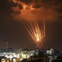 Palestinians in Gaza fire rockets at Israel on August 5, 2022. (MAHMUD HAMS / AFP)