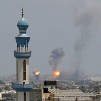 Smoke billows from an Israeli air strike in Khan Younis in the southern Gaza Strip on August 6, 2022. (AFP)