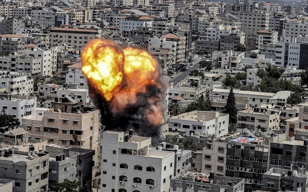 A fireball after an Israeli air strike in Gaza City on August 6, 2022. Israel apparently warned the occupants of the building before the strike. The Israel Defense Forces says it is carrying out strikes on terror targets as barrages of rockets are fired at Israeli towns. (Ashraf Amra/AFP)
