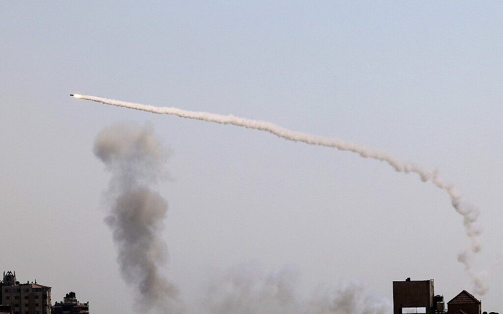 A rocket is fired by Palestinian terrorists in Gaza City toward Israel, on August 7, 2022. (Mohammed Abed/AFP)