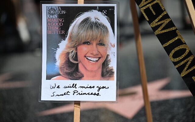 A photo is seen on the star of singer and actress Olivia Newton-John on the Hollywood Walk of Fame in Hollywood, California, on August 8, 2022. (Robyn Beck / AFP)
