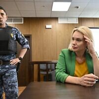 Marina Ovsyannikova (R), the journalist who became known internationally after protesting against the Russian military action in Ukraine during a prime-time news broadcast on state television, appears in court in Moscow, July 28, 2022. (Alexander NEMENOV / AFP)