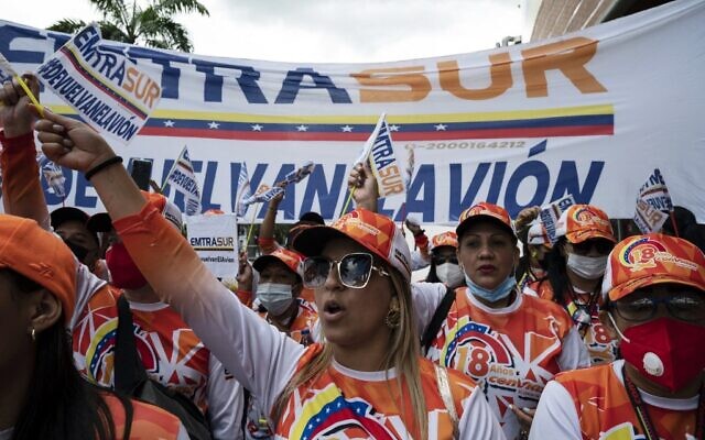 Workers of the Venezuelan airline Conviasa protest in front of the Argentine embassy in Caracas demanding the return of an Emtrasur cargo plane and its crew that were held in Argentina on June 8 under investigation, in Caracas, on August 11, 2022. (Yuri Cortez/AFP)