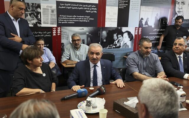 Palestinian Authority Prime Minister Mohammad Shtayyeh speaks at the Palestinian Al-Haq Foundation in the West Bank city of Ramallah after Israel raided and closed an entrance to their offices, on August 18, 2022 (ABBAS MOMANI / AFP)