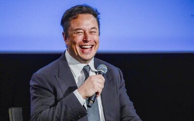Tesla CEO Elon Musk smiles as he addresses guests at the Offshore Northern Seas 2022 (ONS) meeting in Stavanger, Norway, on August 29, 2022. (Carina Johansen/NTB/AFP)