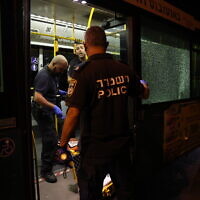 Police inspect the scene of a suspected terror shooting outside Jerusalem's Old City, August 14, 2022. (Yonatan Sindel/Flash90)