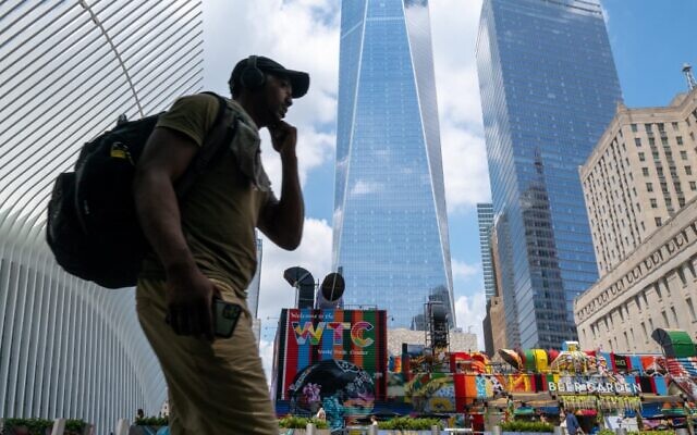 People walk by the One World Trade Center in lower Manhattan a day after President Biden announced that the US killed al Qaeda leader Ayman al-Zawahiri in a drone strike in Afghanistan on August 02, 2022. (Spencer Platt/Getty Images/AFP)