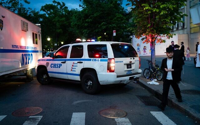 Illustrative: Police and community safety vehicles at a Jewish event in Brooklyn, New York City, May 19, 2022. (Luke Tress/Times of Israel)