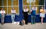 Activists protest against alleged sexual assault at an Ohel facility in Brooklyn, New York, August 21, 2022. (Luke Tress/Times of Israel)