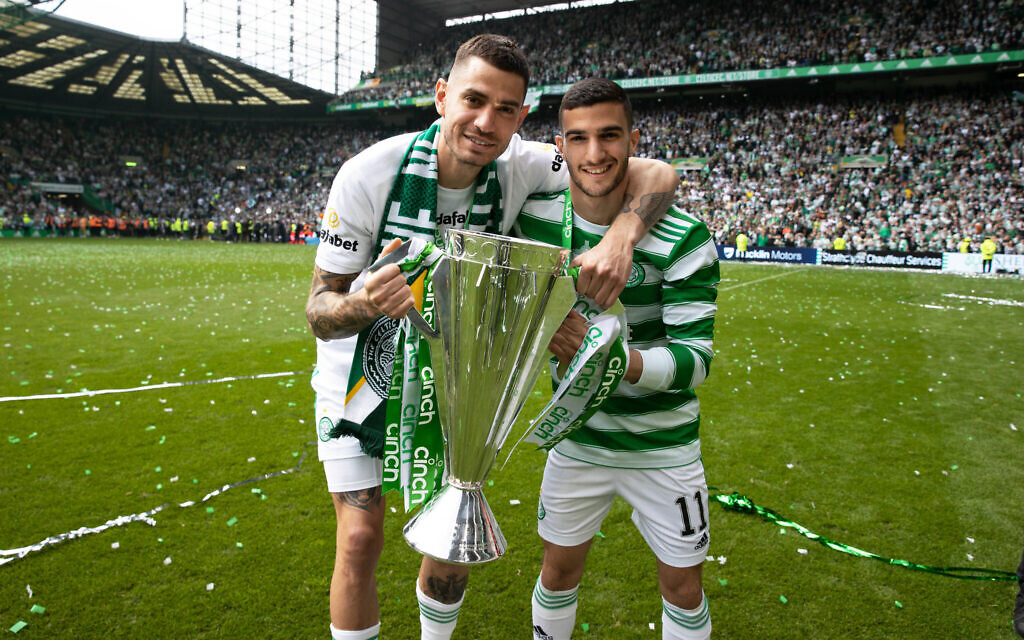 Celtic's two Israeli players at the time — Nir Bitton, left, and Liel Abada — hold the Scottish Premiership Trophy after a match between Celtic and Motherwell at Celtic Park in Glasgow, May 14, 2022. (Craig Williamson/SNS Group via Getty Images/ via JTA)