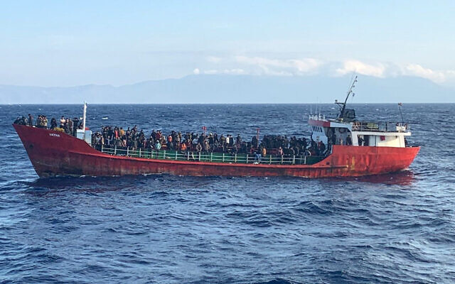 Illustrative: This photo provided by the Hellenic Coast Guard and taken from a vessel shows a ship with migrants near the southern island of Crete, Greece, on October 29, 2021. (Hellenic Coast Guard via AP)