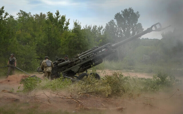 Ukrainian soldiers fire at Russian positions from a US-supplied M777 howitzer in Ukraine's eastern Donetsk region, June 18, 2022. (AP/Efrem Lukatsky, File)