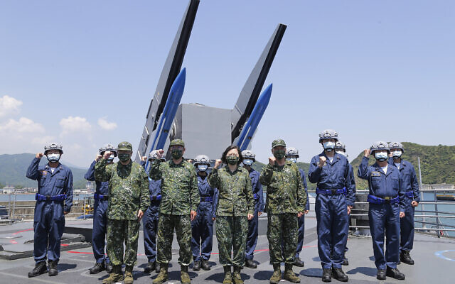 Taiwan’s President Tsai Ing-wen, center, poses with for photos with Taiwanese navy personnel during inspection of Taiwan’s annual Han Kuang exercises in Taiwan July 26, 2022. (Shioro Lee/Taiwan Presidential Office via AP)