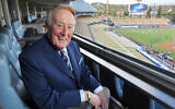 Broadcaster Vin Scully poses for a photo prior a baseball game between the Los Angeles Dodgers and the San Francisco Giants in Los Angeles, Sept. 20, 2016. (Mark J. Terrill/AP)