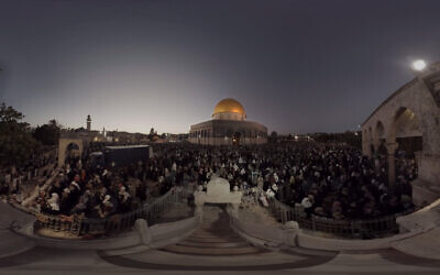 This July 22, 2019, photo taken from video gives a 360-degree view of Ramadan prayers on the plateau of the Dome of the Rock, which can be seen in The Holy City, a virtual reality experience in the metaverse. (The Holy City VR via AP)