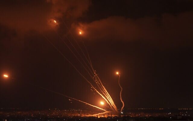 Rockets are seen in the sky fired by Palestinian terrorists toward Israel, in Gaza, Friday, Aug. 5, 2022 (AP Photo/Adel Hana)
