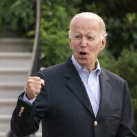 US President Joe Biden responds to reporters' questions as he walks to board Marine One on the South Lawn of the White House in Washington, on his way to his Rehoboth Beach, Delaware, home after his most recent COVID-19 isolation, August 7, 2022. (AP Photo/Manuel Balce Ceneta)
