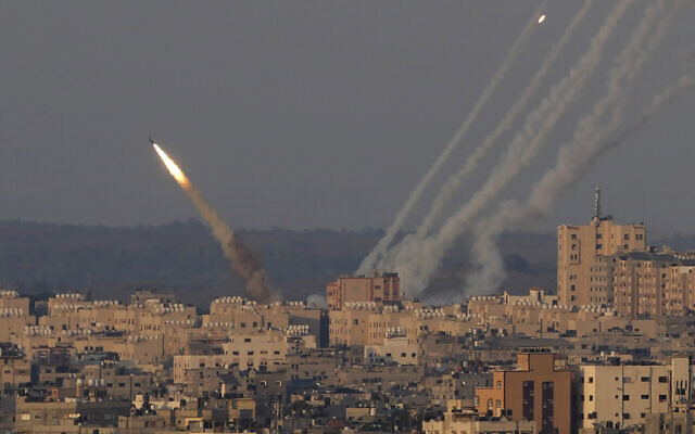 Rockets are launched from the Gaza Strip towards Israel, in Gaza City, Sunday, Aug. 7, 2022. (AP Photo/Hatem Moussa)