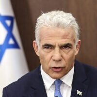 Prime Minister Yair Lapid heads a cabinet meeting in Jerusalem on July 31, 2022. (Gil Cohen-Magen/Pool Photo via AP)