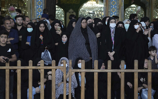 Mourners attend a procession commemorating the holiday of Ashoura, which marks the death anniversary of Imam Hussein, the grandson of Prophet Muhammad, who was killed with 72 of his companions in the 7th century in the Battle of Karbala in present-day Iraq, in Tehran, Iran, on August 8, 2022. (Vahid Salemi/AP)