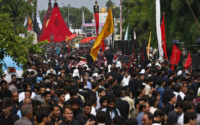 Shiite Muslims participate in a procession, in Islamabad, Pakistan, in honor of the holiday of Ashoura on August 8, 2022. (Anjum Naveed/AP)