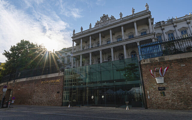 The sun sets behind the Palais Coburg where closed-door nuclear talks take place in Vienna, Austria, August 5, 2022. (AP Photo/Florian Schroetter, File)