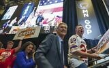 In this May 14, 2022, file photo, Minnesota GOP gubernatorial candidate Dr. Scott Jensen, center, takes the stage after winning the party's endorsement for governor, at the Minnesota State Republican Convention in Rochester, Minn. (Glen Stubbe/Star Tribune via AP, file)